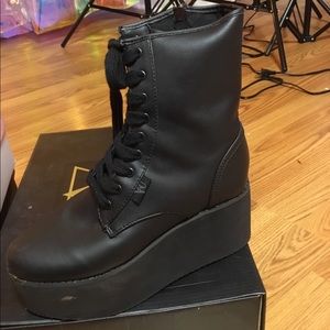 Yru leather platform boots.